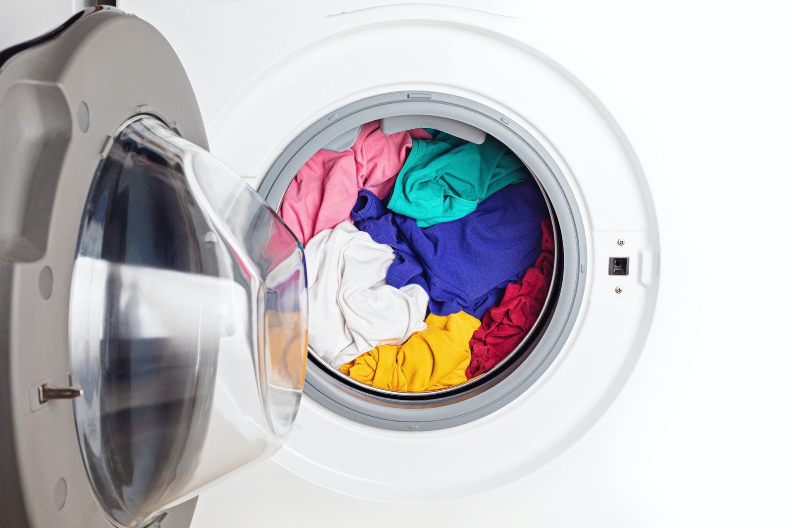 Washing or drying machine loaded with the laundry. Washing, spring cleaning idea